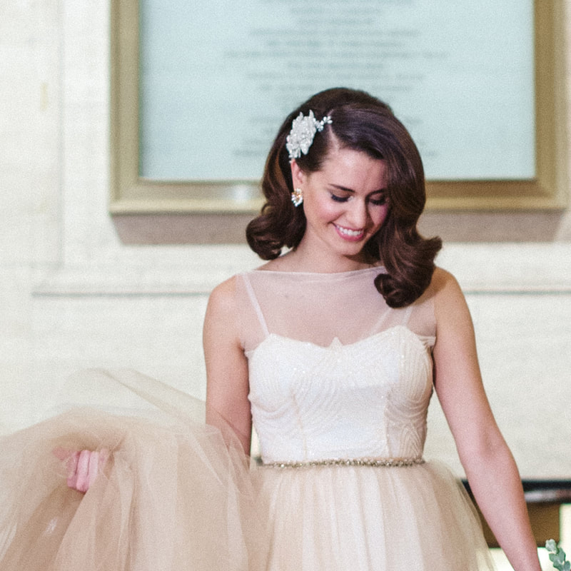 Vintage inspired brunette bride with tulle skirt and floral headpiece