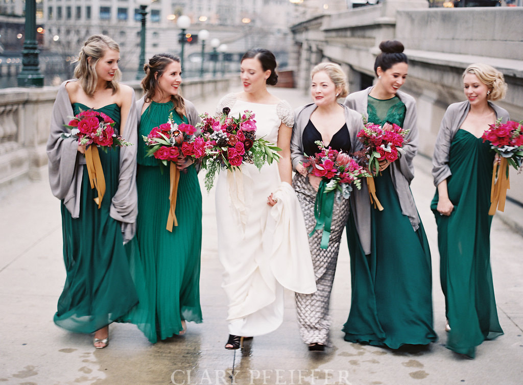 Winter bridal party walking in Chicago. Makeup and Hair by Nika Vaughan Bridal Artists