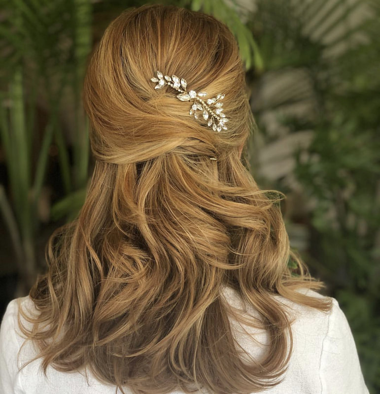 Redhead bride showing bridal half up hair style with hair pin